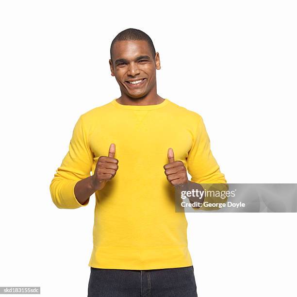 portrait of a man giving a thumbs up - black thumbs up white background stock-fotos und bilder