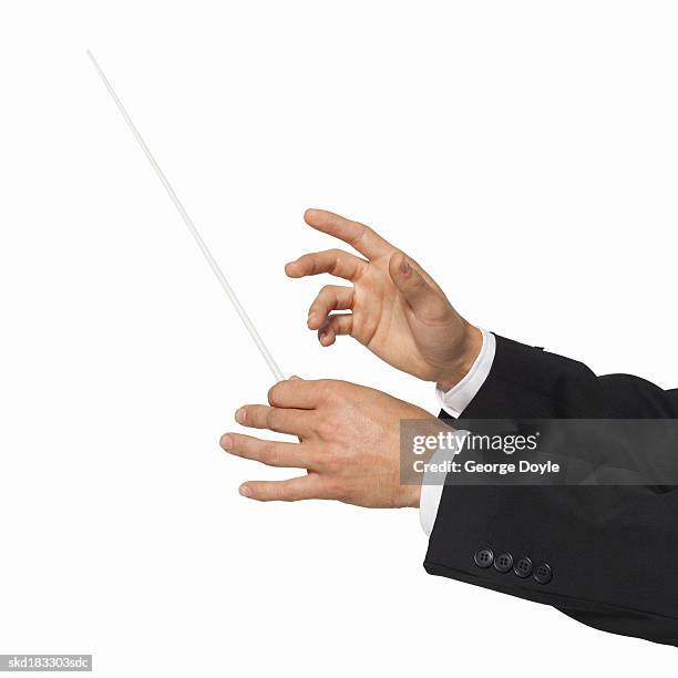 close up of a conductor's hands - dirigent stock-fotos und bilder