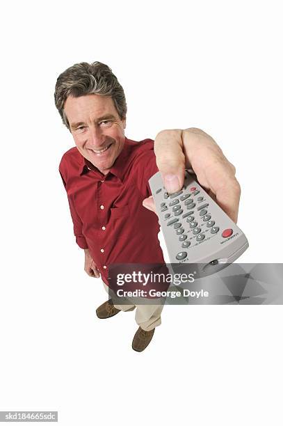 persons holding a red and black remote controllers ·... 745 Man Pointing Remote Control Stock Photos, High-Res Pictures, and ...