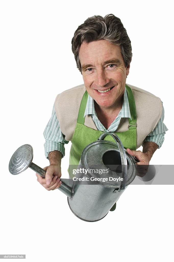 Elevated view of a man holding a watering can