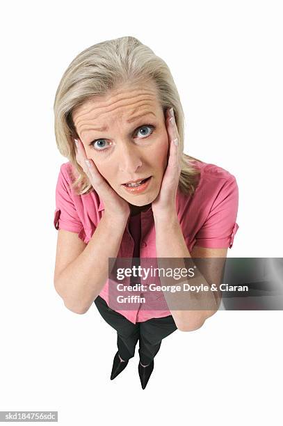 portrait of woman with hand touching face - alleen één oudere vrouw stockfoto's en -beelden