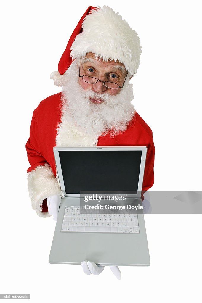 Elevated view of Santa Claus holding laptop