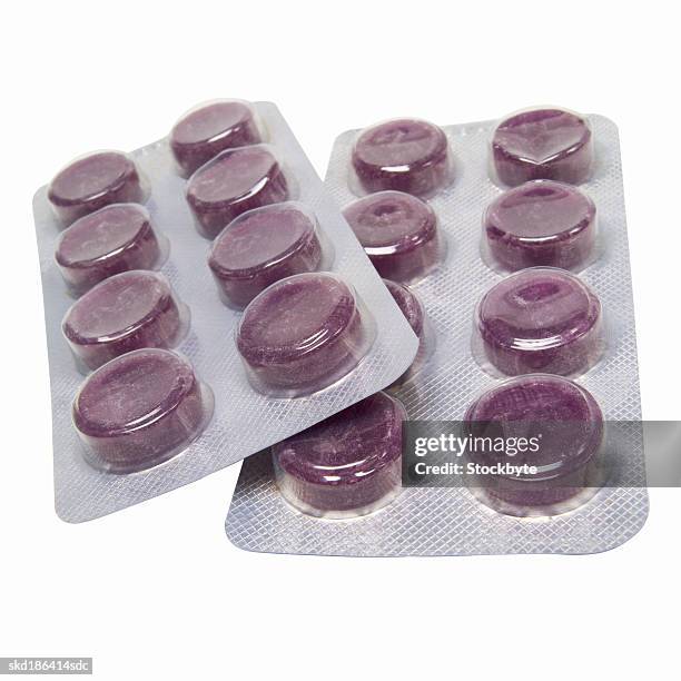 close up of pills in a blister pack - cough lozenge stock pictures, royalty-free photos & images