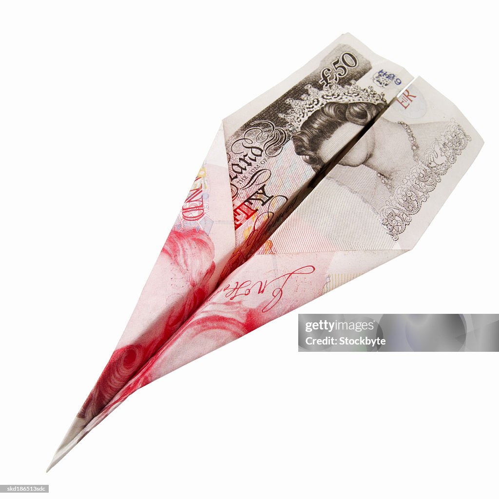 Close up of a 50 pound note sterling folded into a plane