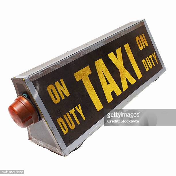 close up of a taxi sign - taxi sign stock pictures, royalty-free photos & images