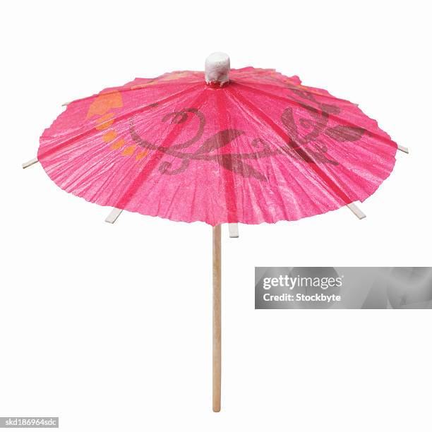 close up of a cocktail umbrella - cocktail stick stock pictures, royalty-free photos & images