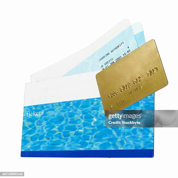 close up of travel airline tickets and credit card - travel​ stock pictures, royalty-free photos & images