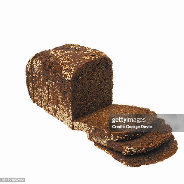 close up of a loaf of healthy brown bread - loaf stock pictures, royalty-free photos & images