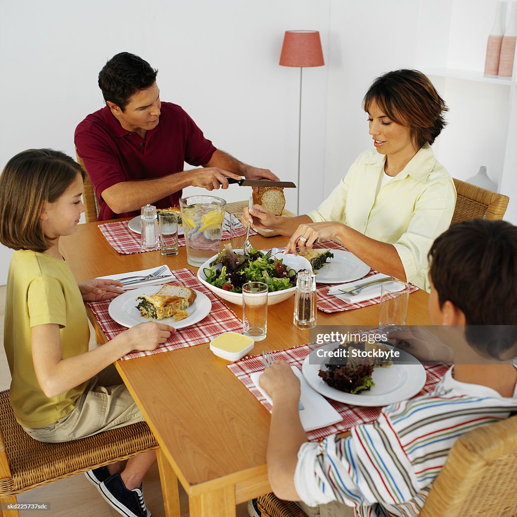 Family Having Dinner Together High-Res Stock Photo - Getty Images