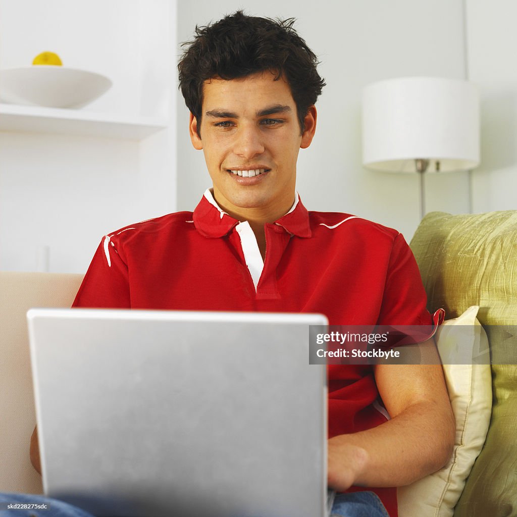 Close-up of young man working on laptop