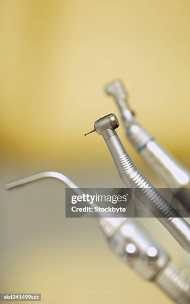 close-up of dental drills and suction equipment - ツール ストックフォトと画像