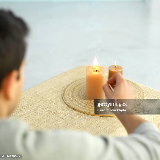 man lighting candles - matchstick man stock pictures, royalty-free photos & images