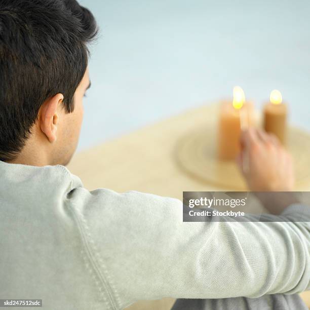 man lighting an incense burner - matchstick man stock pictures, royalty-free photos & images