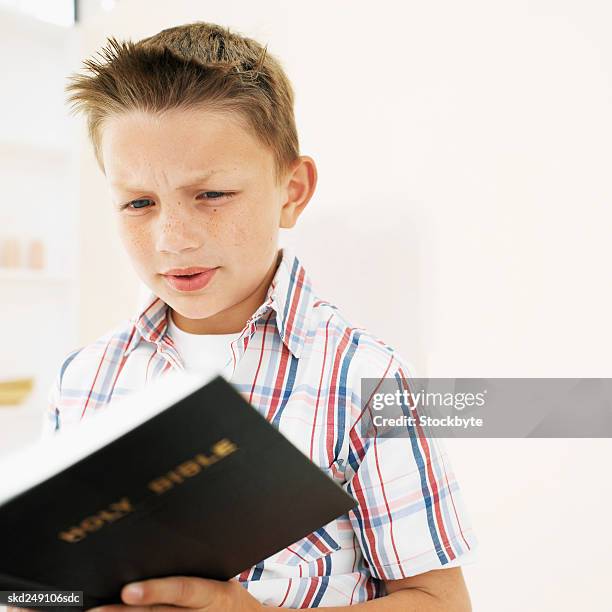 Boy Reading Scriptures 481 Boy Reading Bible Stock Photos, High-Res Pictures, and Images ...