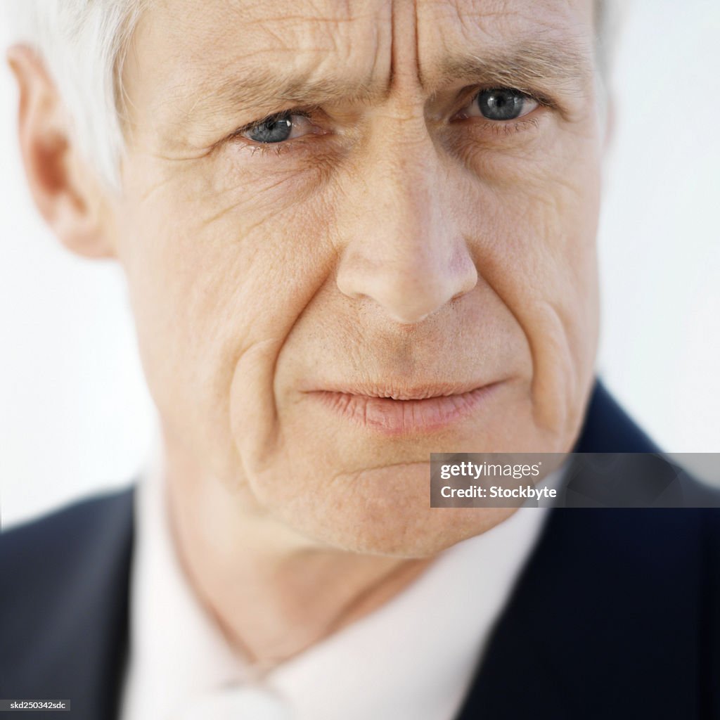 Front view portrait of businessman frowning