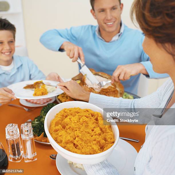 family having dinner together - carvery stockfoto's en -beelden