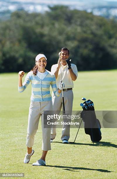 young couple cheering after a round of golf - after stock pictures, royalty-free photos & images