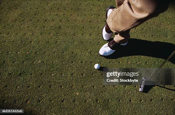 close-up of a golfer's shoes and golf club - golf club - fotografias e filmes do acervo