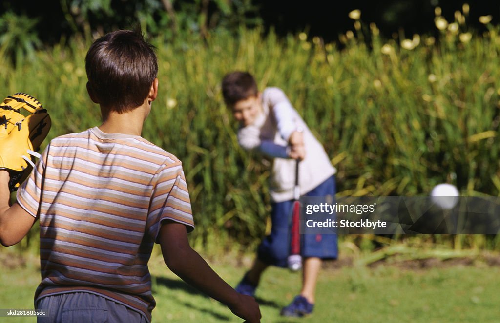 Boys (10-12) playing baseball