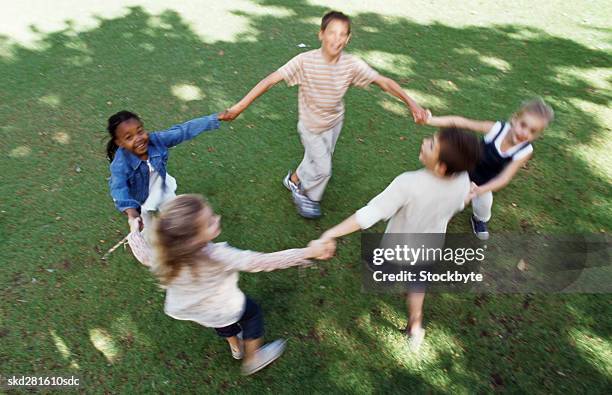 children playing ring a rosy - ring around the rosy stock pictures, royalty-free photos & images