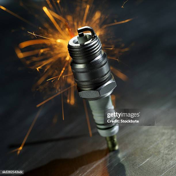 close-up of a spark plug with sparks exploding - sparks bildbanksfoton och bilder