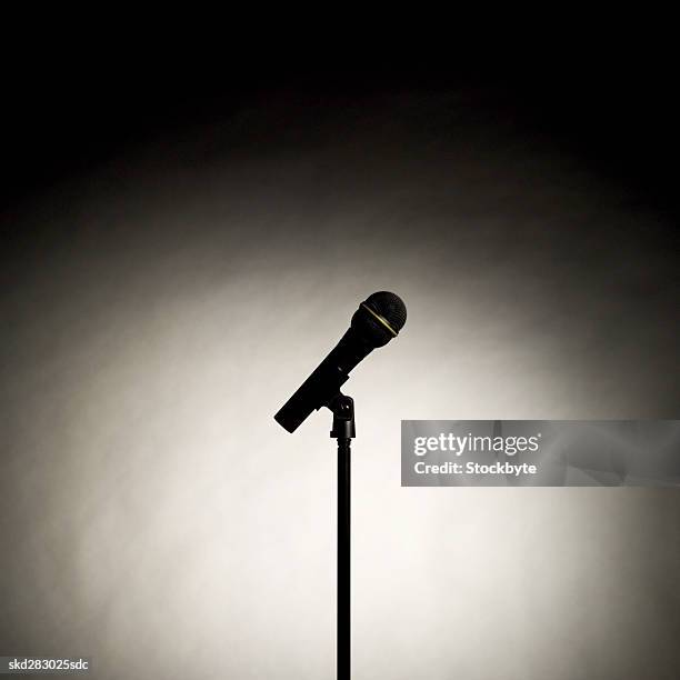 microphone and stand in the spotlight - stand up ストックフォトと画像