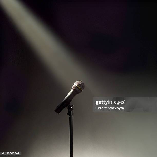 microphone and stand in the spotlight - stand up ストックフォトと画像