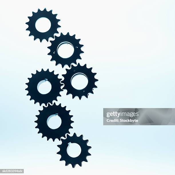 close-up of six cogs - movimiento perpetuo fotografías e imágenes de stock