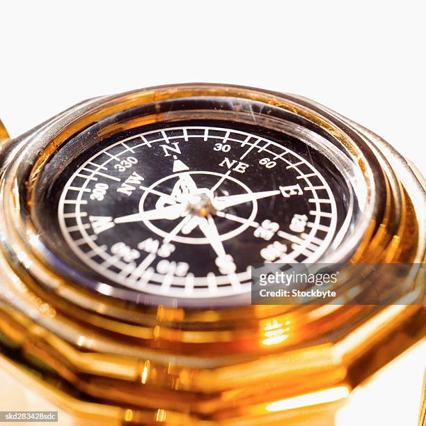 close-up of travel compass - travel​ stock pictures, royalty-free photos & images