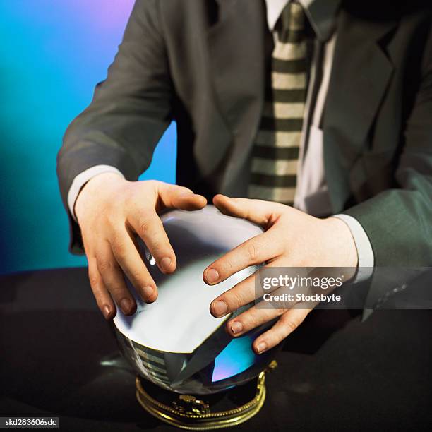 close-up mid section of man touching crystal ball - the cinema society dkny host a screening of the twilight saga breaking dawn part 1 outside arrivals stockfoto's en -beelden