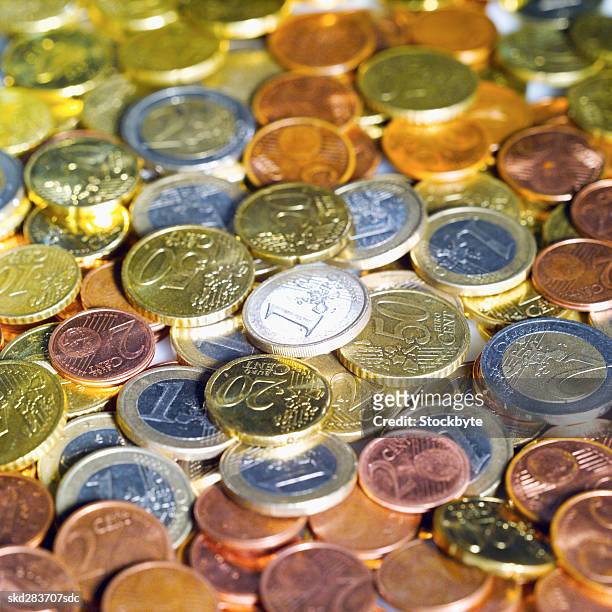 close-up of euro coins of various denominations - fünfzig euro cent stock-fotos und bilder