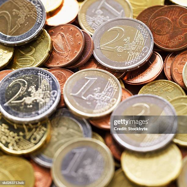 close-up of euro coins of various denominations - fünfzig euro cent stock-fotos und bilder