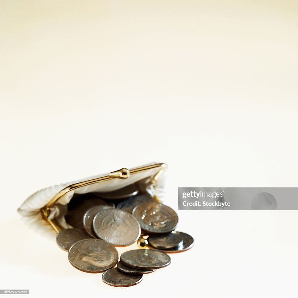 Close-up of American coins spilling out of change purse