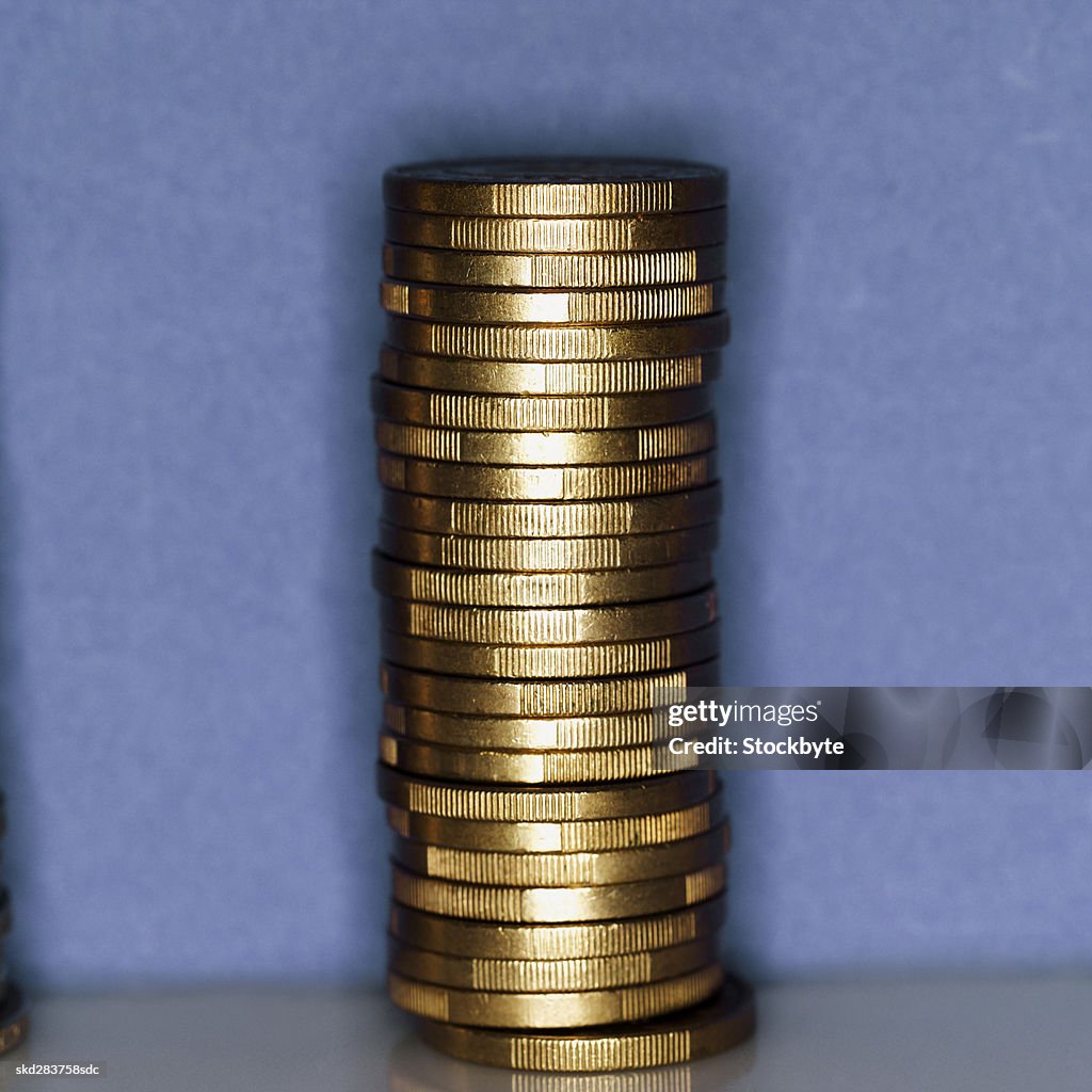 Close-up of a stack of one euro coins