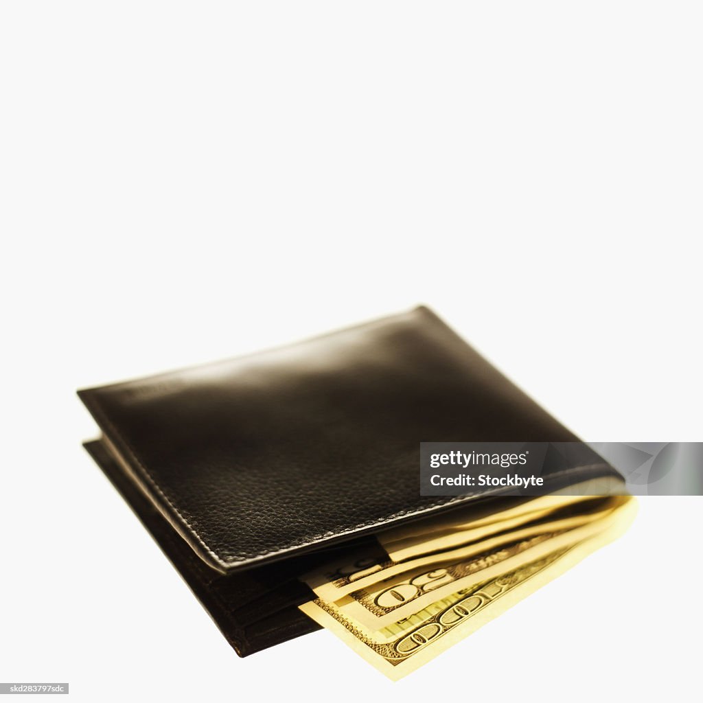 Close-up of wallet containing various American dollar bills