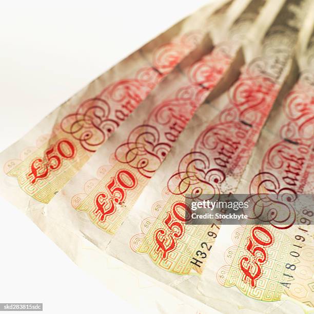 close-up of four u.k.. fifty pound notes - 50 pound notes stock pictures, royalty-free photos & images