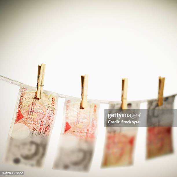 close-up of fifty pound notes hanging on clothesline - fifty pound note ストックフォトと画像