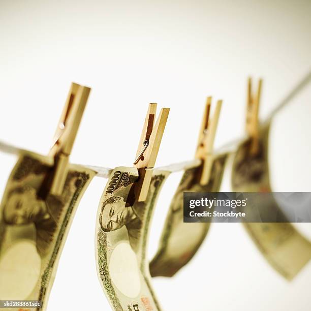 close-up of various japanese yen notes hanging on clothesline - only japanese ストックフォトと画像