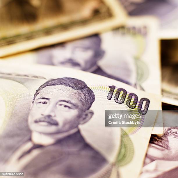 close-up of japanese yen bank notes - five thousand yen note stock pictures, royalty-free photos & images