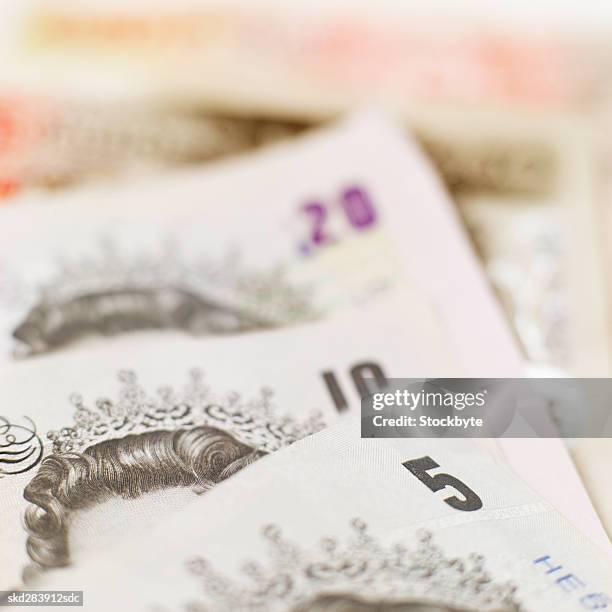 close-up of various u.k.. pound notes - twenty pound note stock pictures, royalty-free photos & images