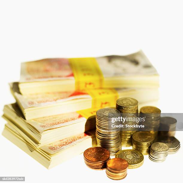 close-up of stacks of u.k.. pound notes and coins - fifty pound note ストックフォトと画像