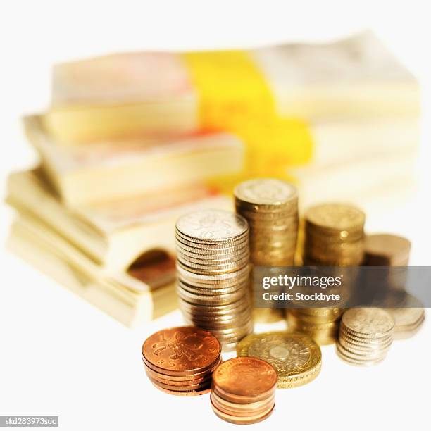 close-up of stacks of u.k.. pound notes and coins - fifty pound note ストックフォトと画像