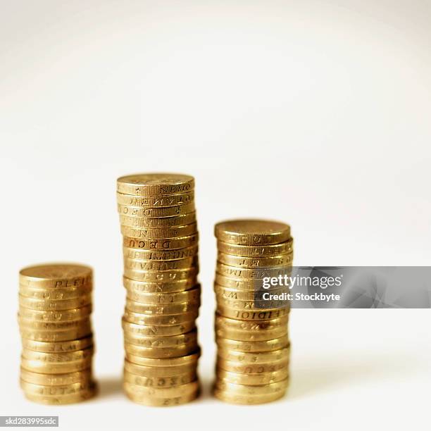 close-up of stacks of u.k.. coins - pound coins stock pictures, royalty-free photos & images