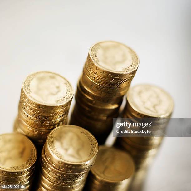 close-up of stacks of one pound coins - uk coins stock pictures, royalty-free photos & images