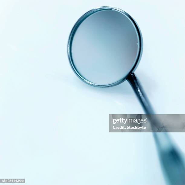 close-up of a dental mirror - espejo dental fotografías e imágenes de stock
