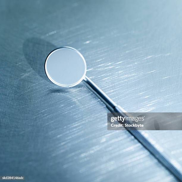close-up of a dental mirror - angled mirror stock pictures, royalty-free photos & images