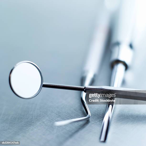 close-up of dental tools - espejo dental fotografías e imágenes de stock