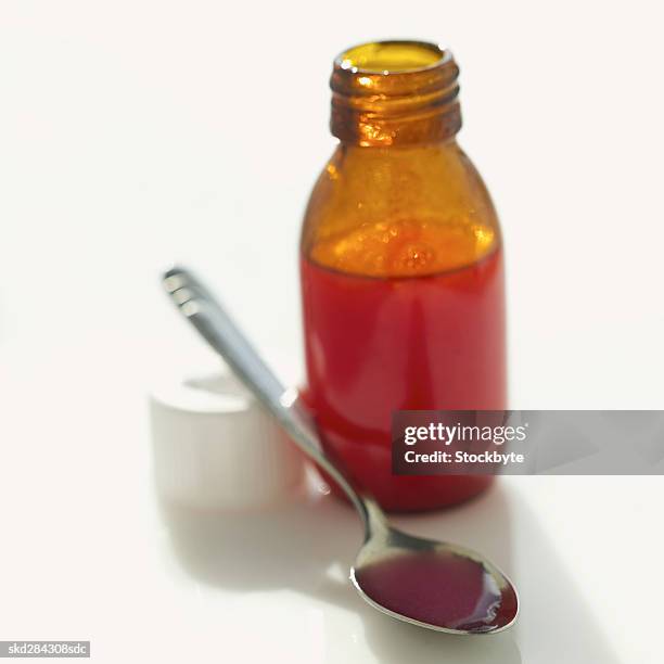 close-up of cough syrup - cough medicine stock pictures, royalty-free photos & images