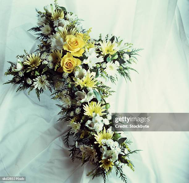 cross shaped bouquet - funeral of manchester arena terror attack victim takes place stockfoto's en -beelden