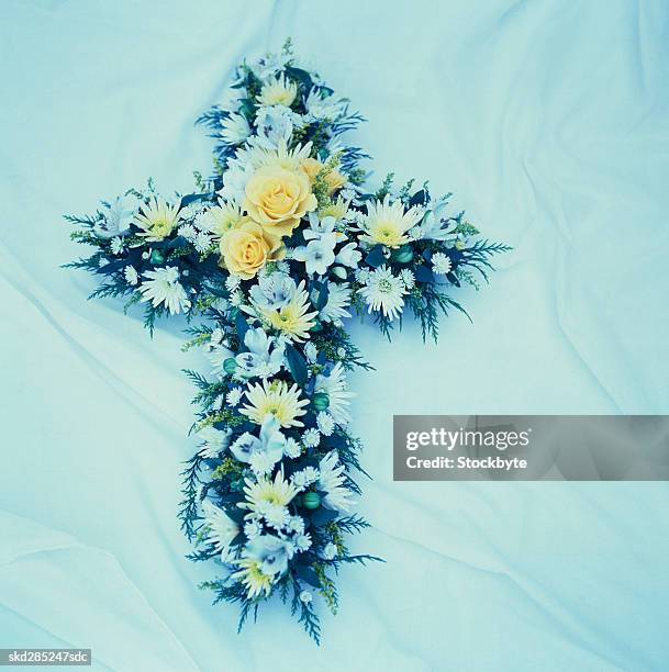 cross shaped bouquet - funeral of manchester arena terror attack victim takes place stockfoto's en -beelden